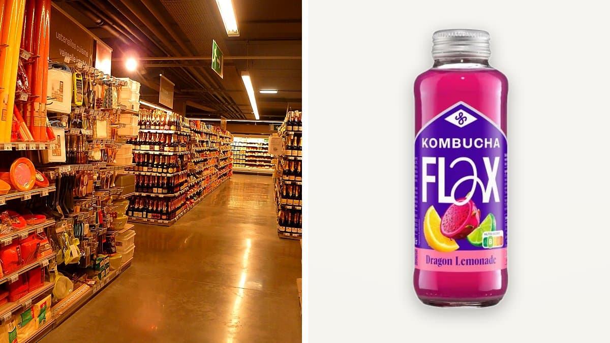 Botella de 33 cl de kombucha Flax & Kale con etiqueta de color en nevera de supermercado, rodeada de otras bebidas