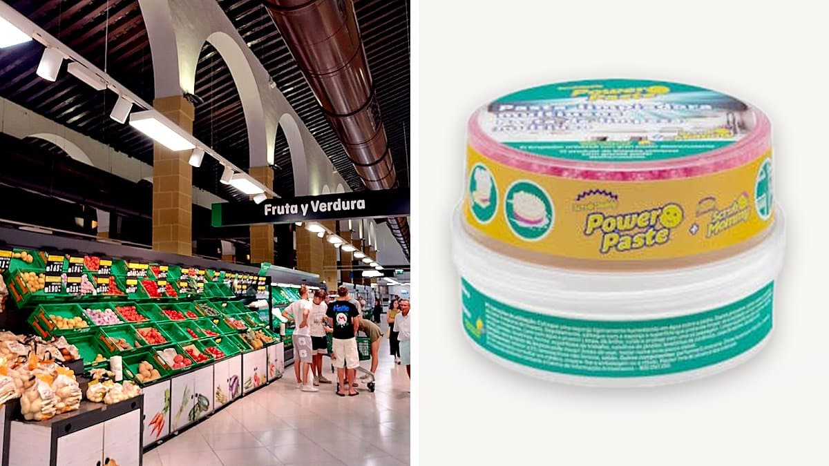 Tarro blanco de pasta limpiadora Power Paste con esponja amarilla sonriente sobre encimera mojada de acero inoxidable, gotas de agua, iluminación lateral suave