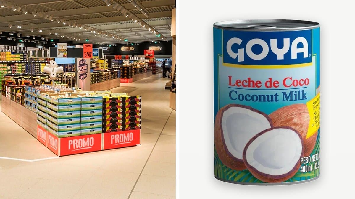 Lata de leche de coco Goya de 400 ml rodeada de ingredientes para curry, un bol de batido de coco y verduras frescas en una cocina española