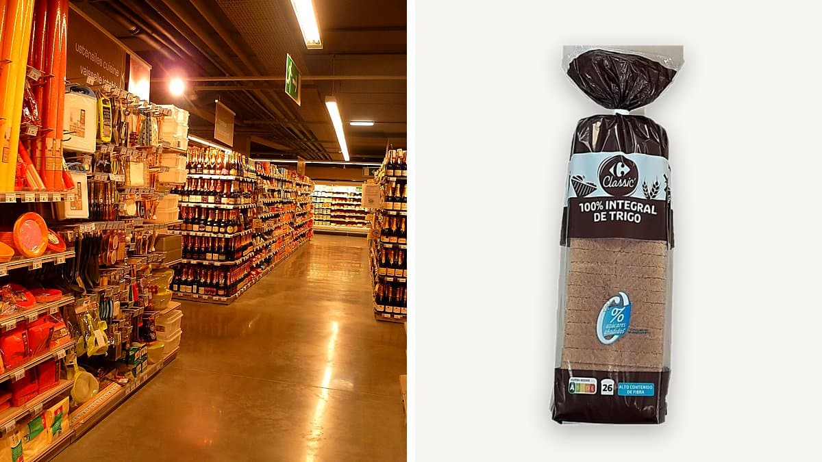 Barra de pan de molde integral con corteza de trigo Carrefour Classic de 820 gramos en bandeja de supermercado, envoltorio de plástico transparente mostrando la textura crujiente de la corteza integral.