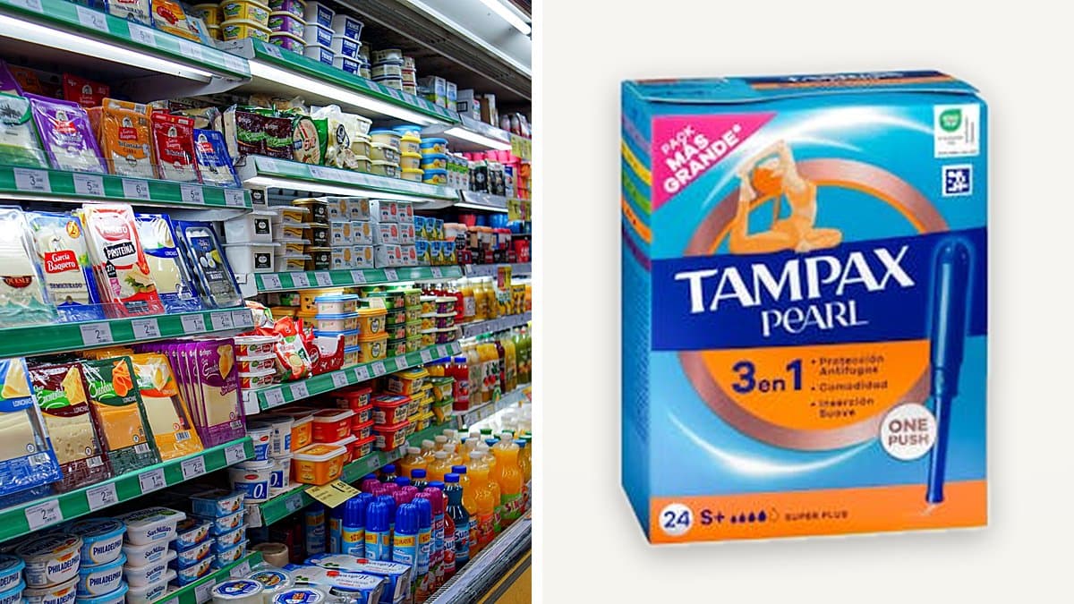 Caja de tampones Tampax Pearl en un estante de baño minimalista junto a toallas dobladas de algodón blanco