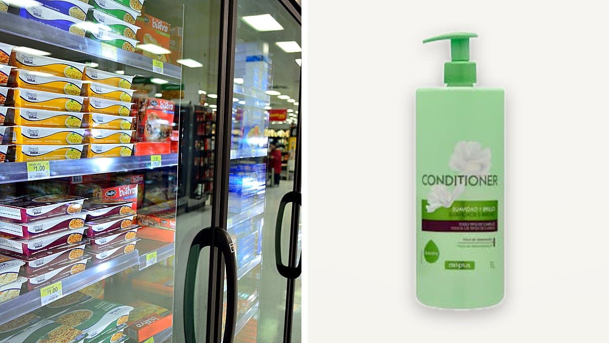 Botella de 1 litro de acondicionador Deliplus Suavidad y Brillo en estantería de baño con toalla blanca, comb y gotas de agua con luz natural