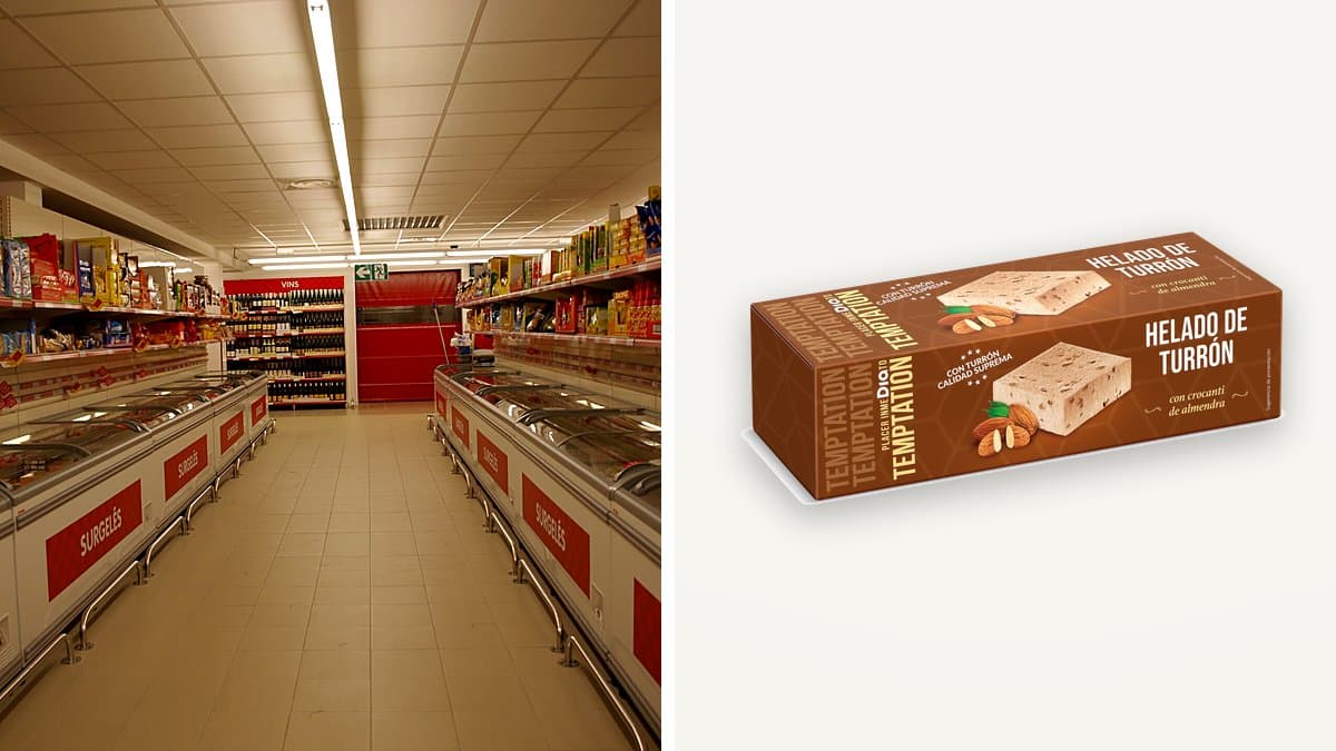 Envase de helado de corte turrón Día Temptation sobre hielo en una bandeja, congelador abierto al fondo